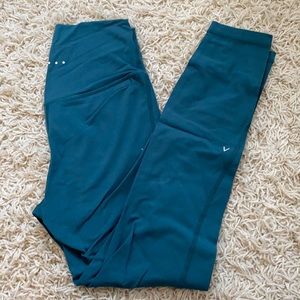 ACTA leggings Size M never worn. Green/Blue
